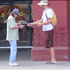 Giving twenty dollars to people who give him anything