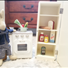 Maileg's cooler has plenty of shelf space for the rabbit's groceries 