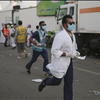 Medics rush to the site where pilgrims were crushed and trampled to death 