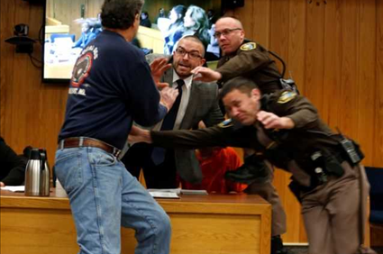 Father of 3 victims attacks Larry Nassar during sentencing